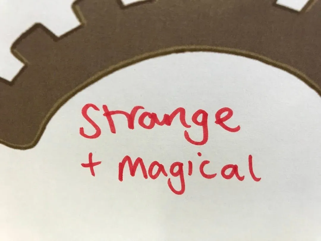 Strange + Magical written in red pen