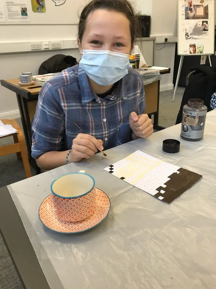 Girl holding paint brush