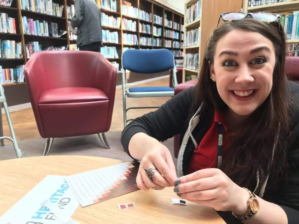 Woman peeling stickers.