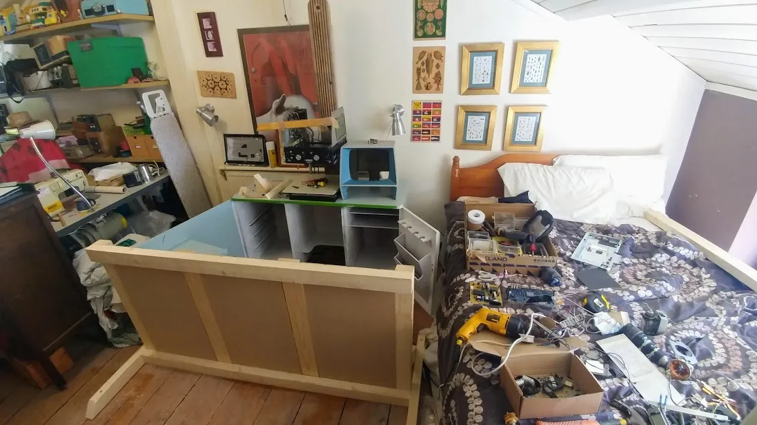 Desk with screen behind a wooden barrier