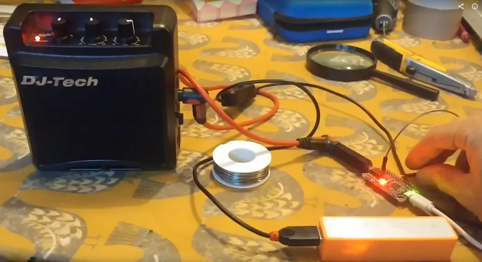 guitar amp plugged into circuit board.