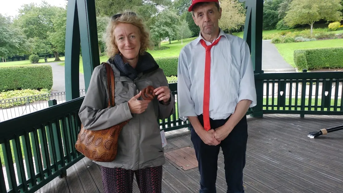 Woman holding a fake dog poo.