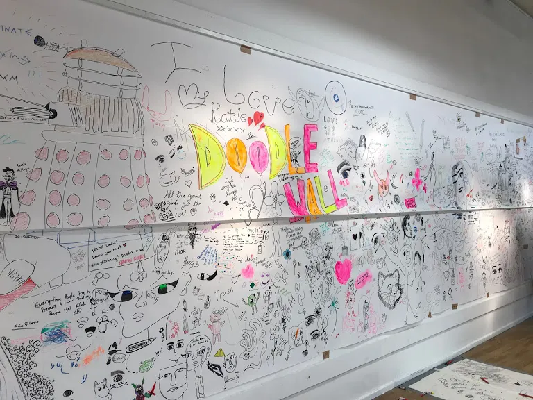 Walls covered in drawings.