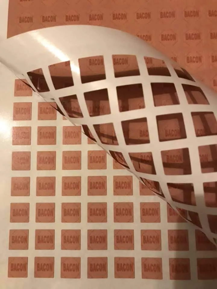 Ration token stickers sheets with outer bit being peeled off.