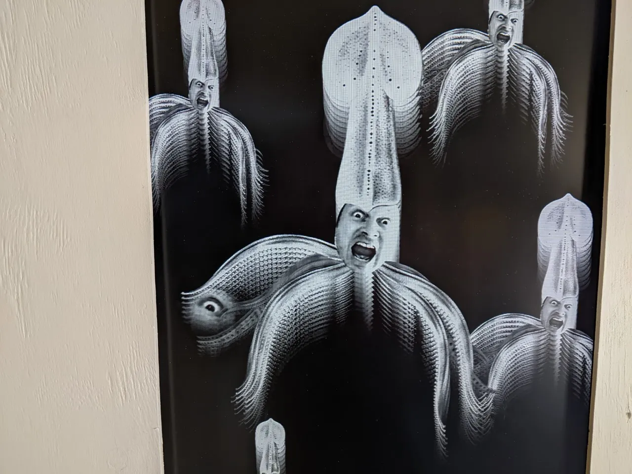 Lots of squid with the face of the same man!