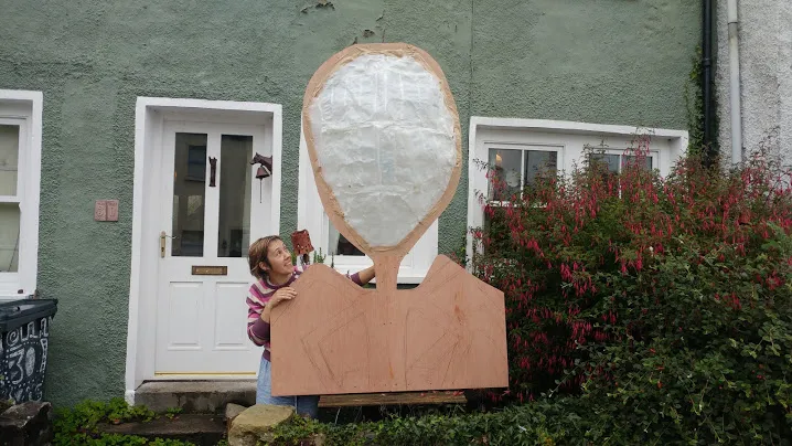 Jennie standing next to prototype witch