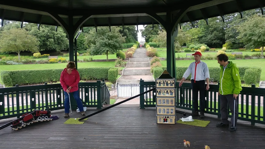 John pointing to trump tower