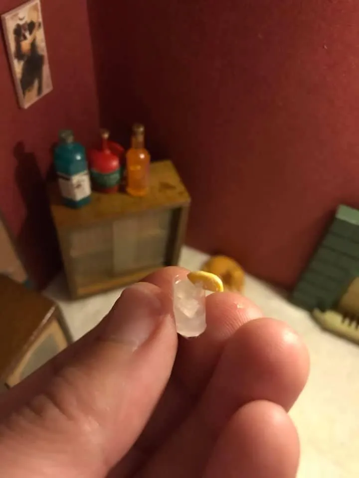 Tiny glass in hand