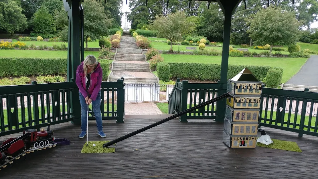 Woman lining up golf shot