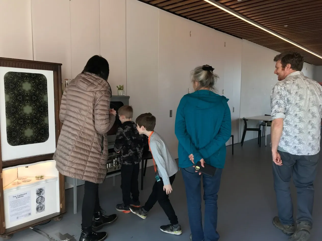 Two boys, two women and Chris all looking into the screen