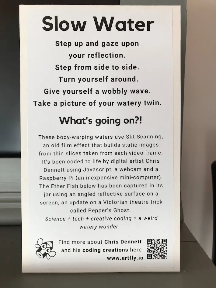 Sign saying: Slow Water: Step up and gaze upon your reflection.