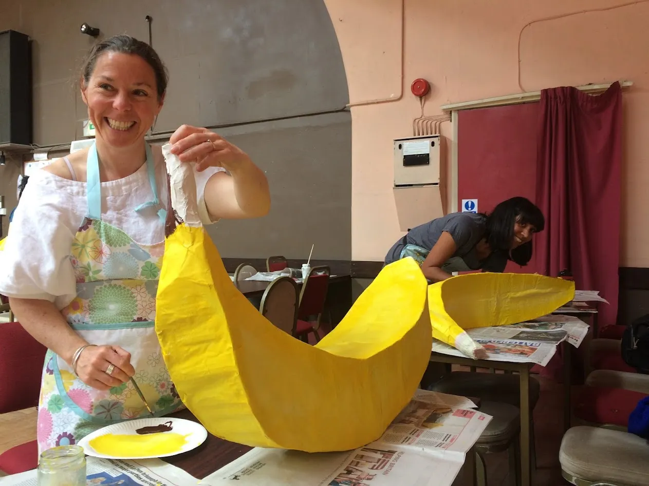 two women painting card bananas