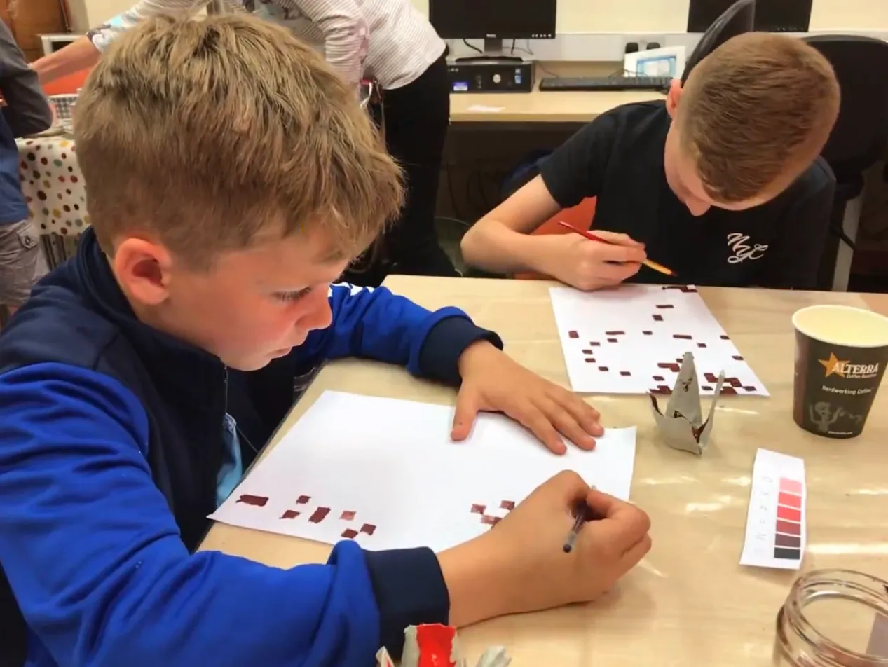 Two boys painting.