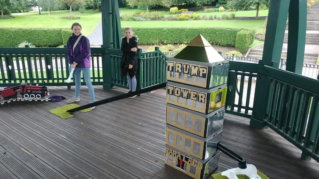 Two girls playing the hole