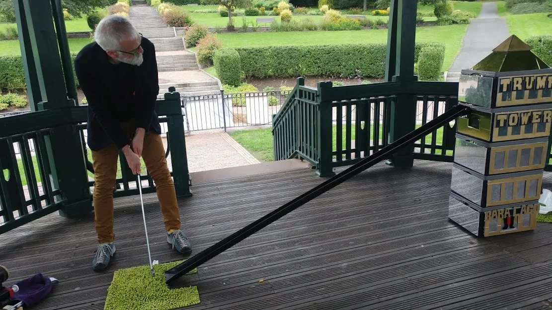 Man looking at tower after taking shot.