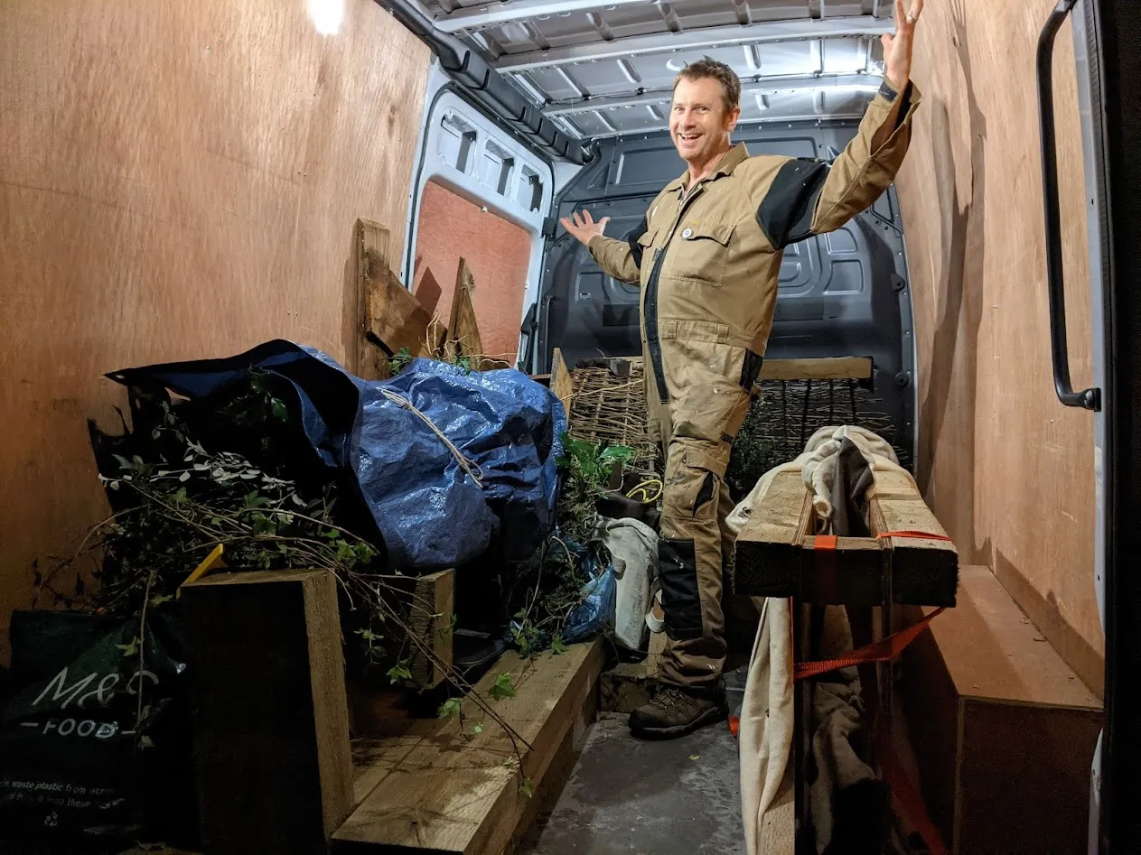 man standing in van