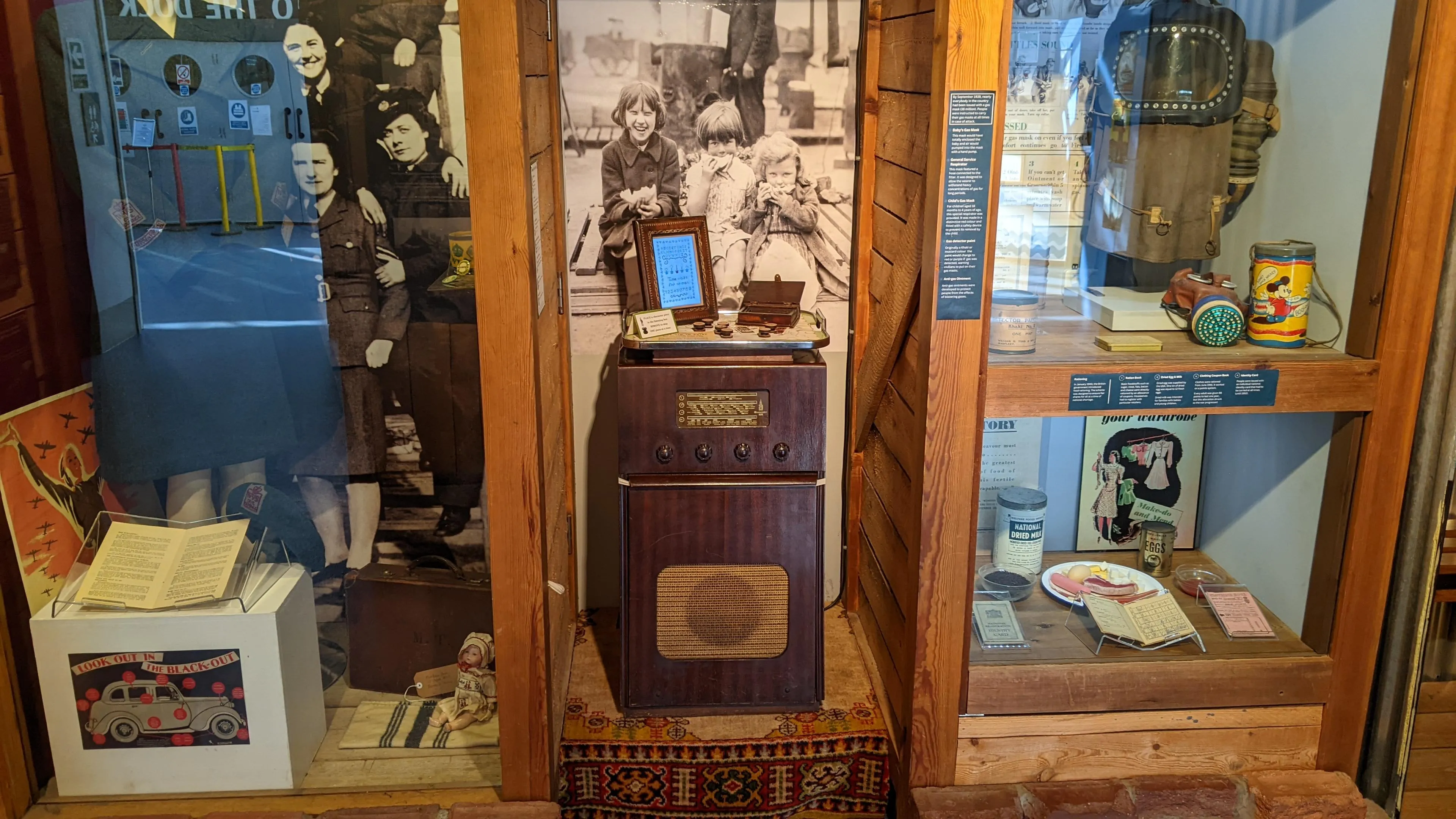Large old fashioned radio with tray on top containing a picture
frame.