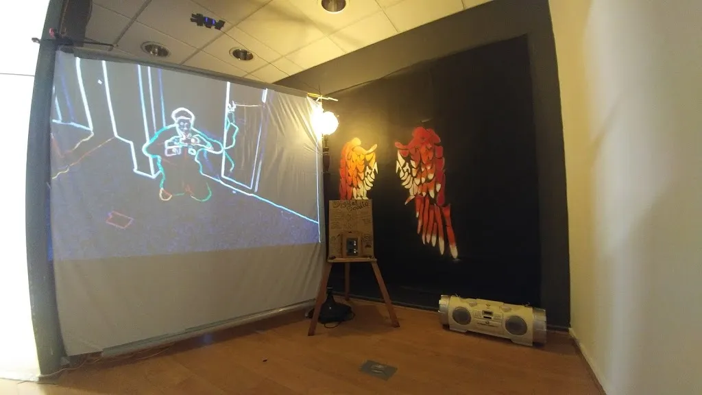 Projected screen, control box and speaker in changing room