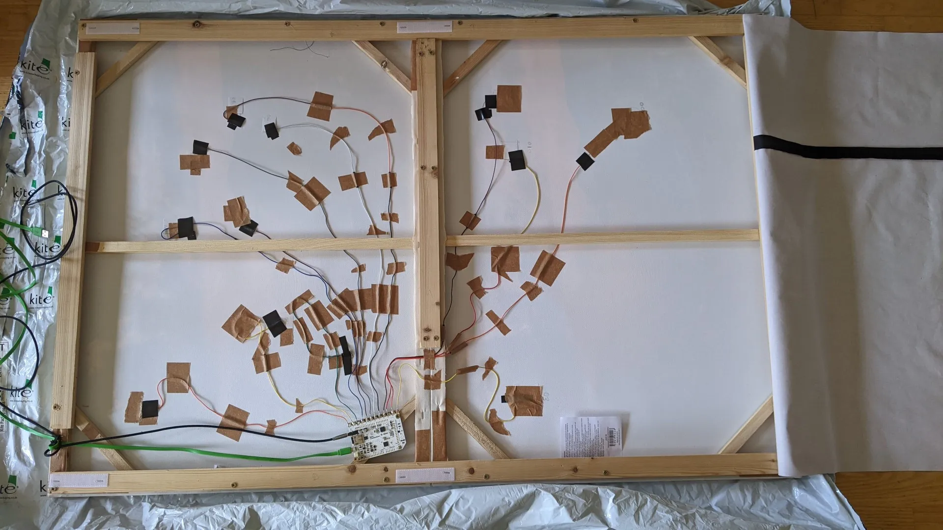 back of a picture frame showing wiring