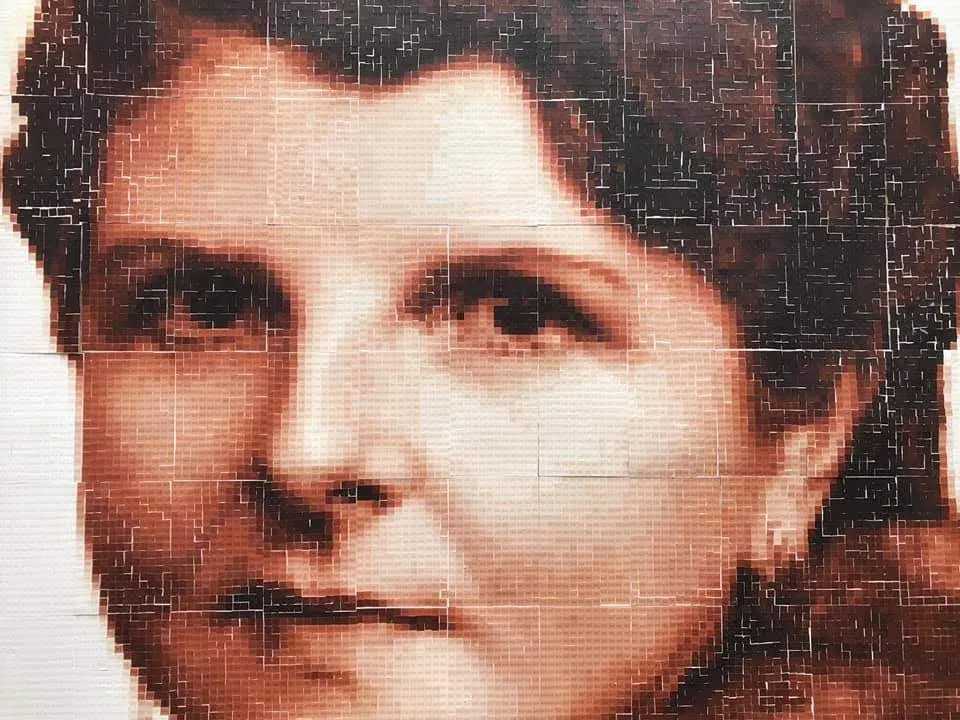 Womans face made from stickers.