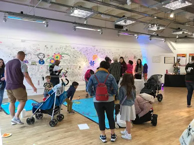 Empty shop with people doodling on the walls and floor.