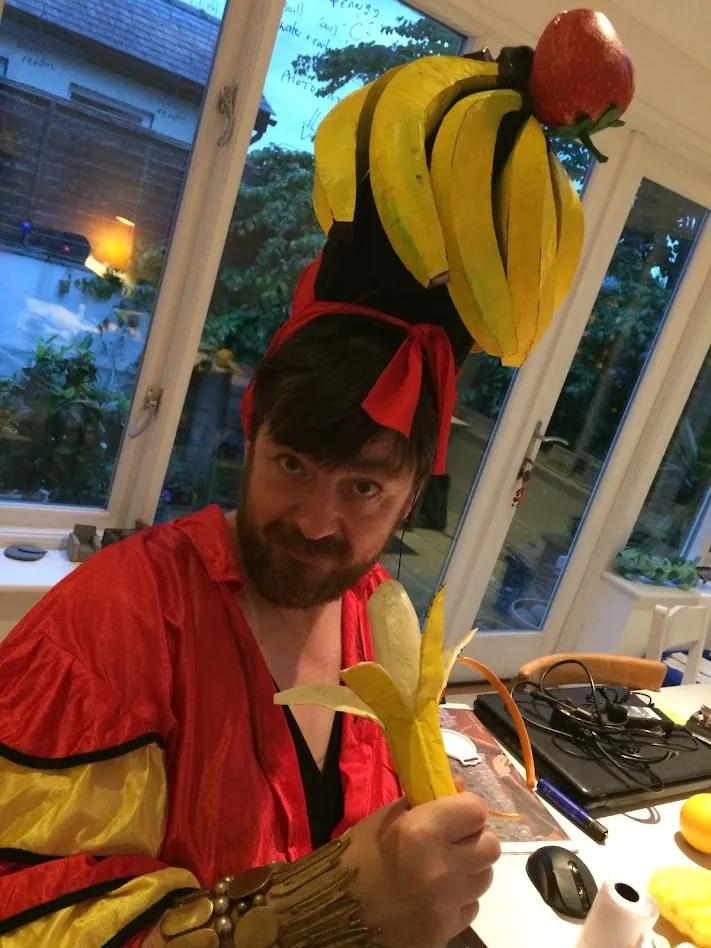 man with beard dressed as carmen miranda