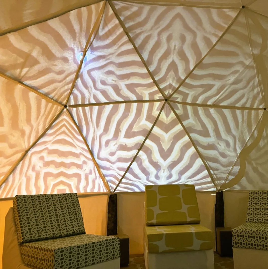 Hexagonal images above three seats.