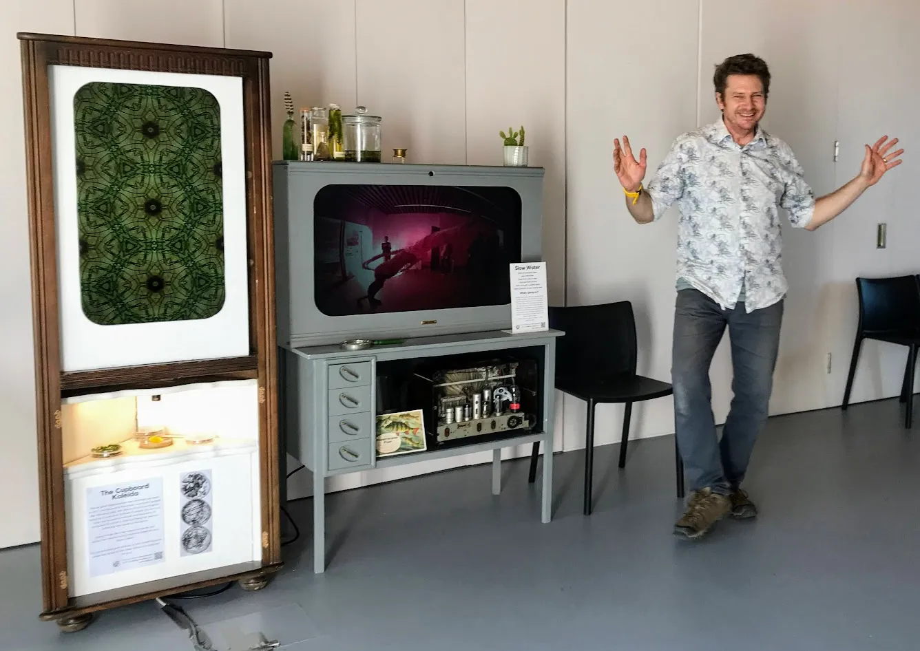 Chris standing next to exhibits