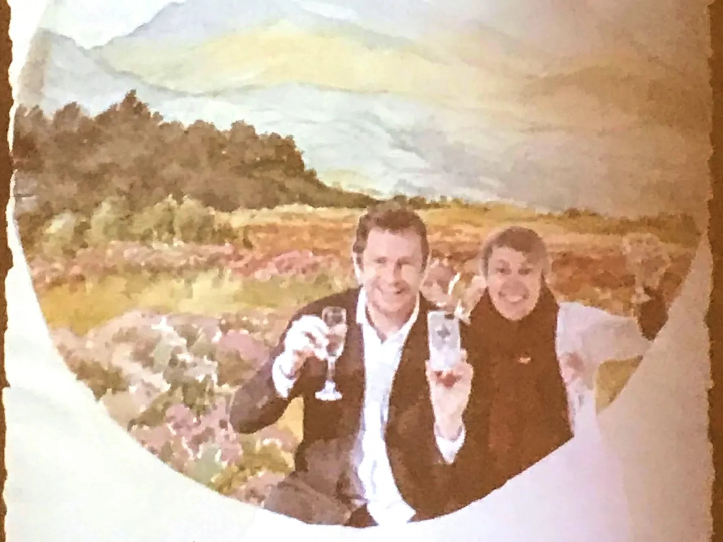 Man and woman smiling inside a painting