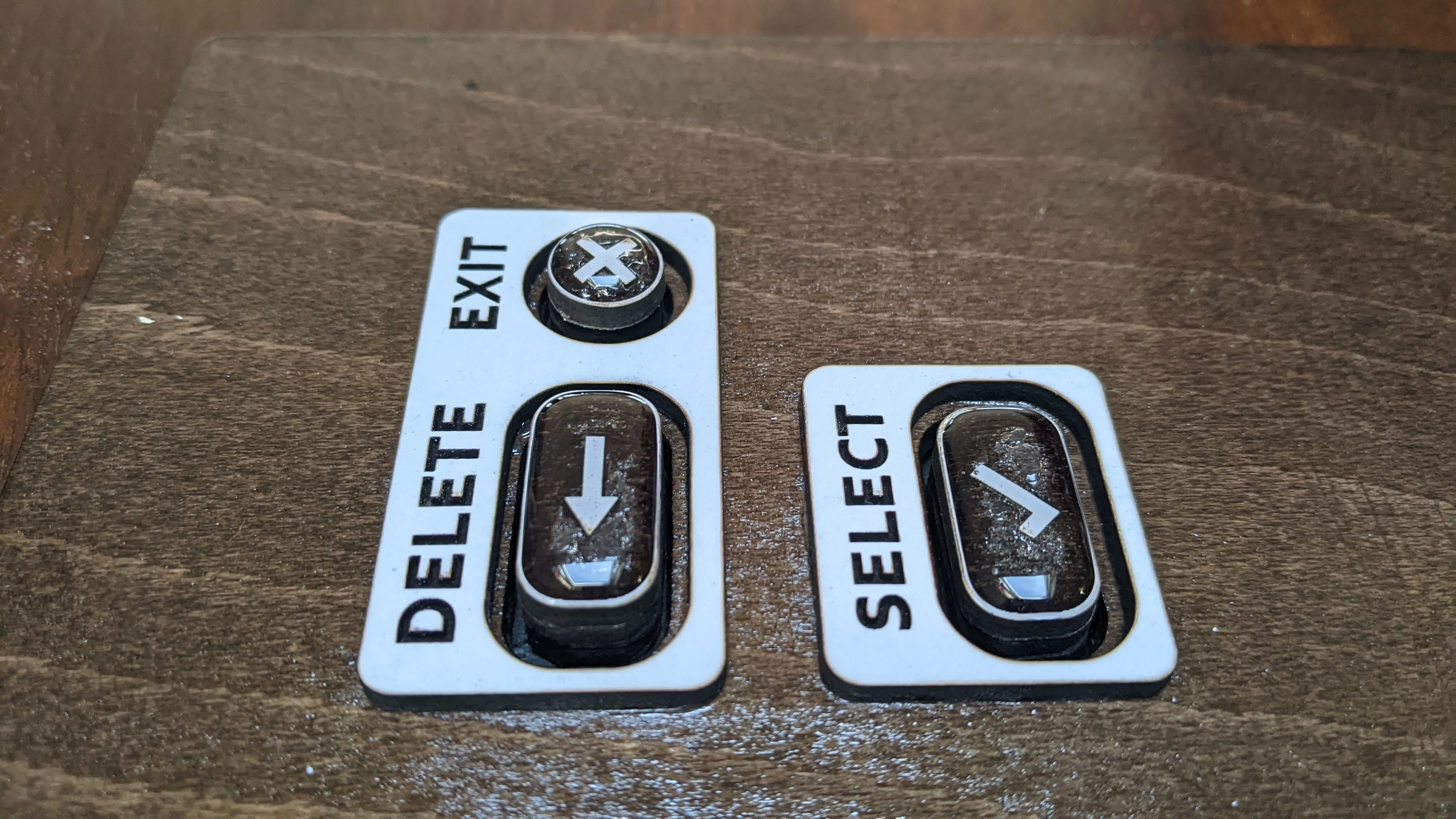 Three buttons with a white frame around them.