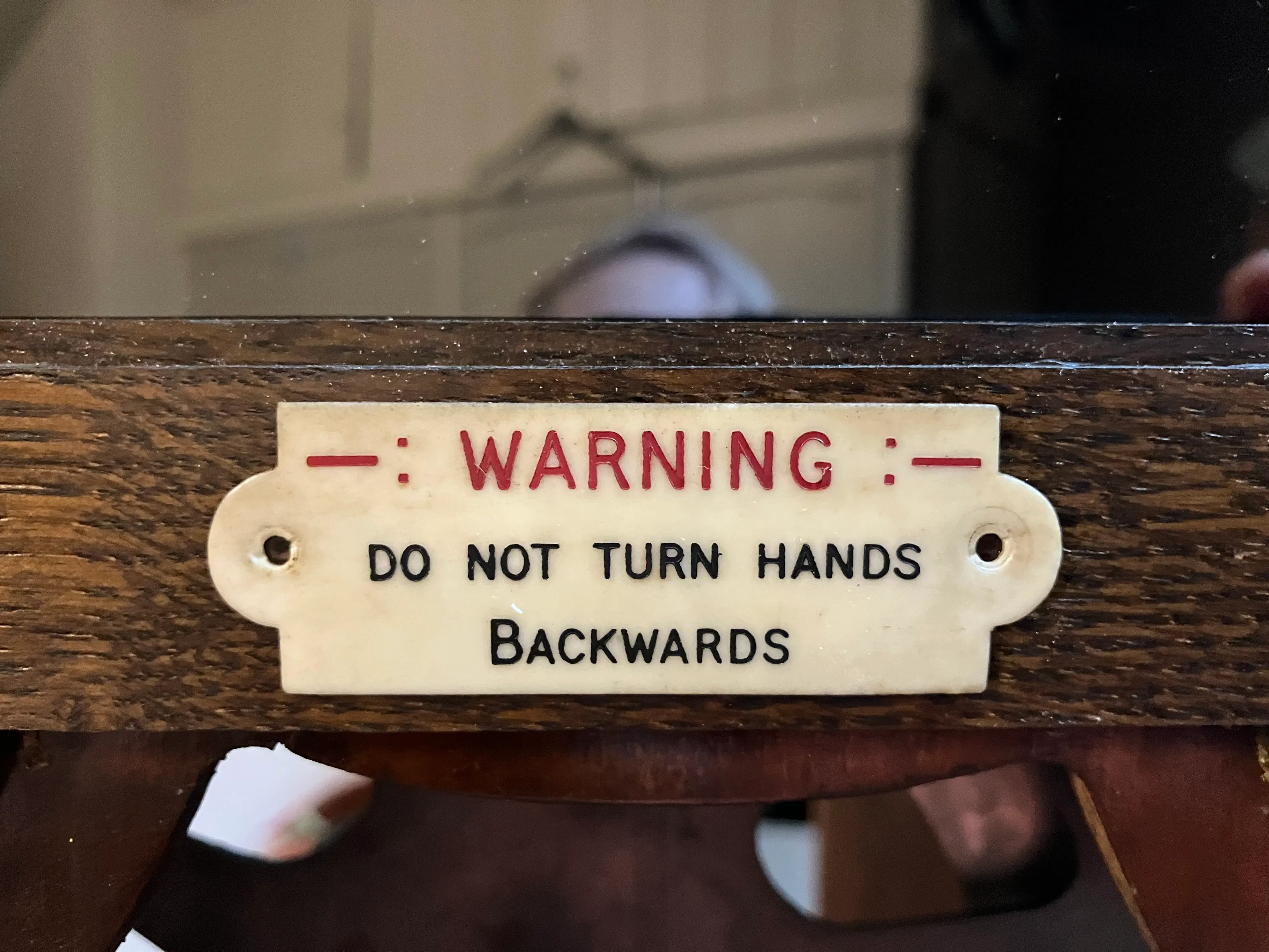 Warning sign on wooden frame.